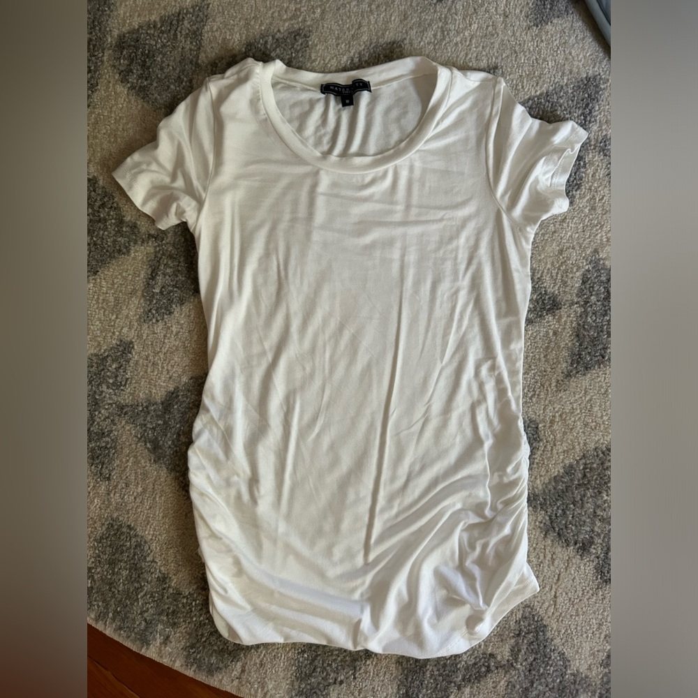 All white maternity shirt, never worn. Super soft and stretchy!